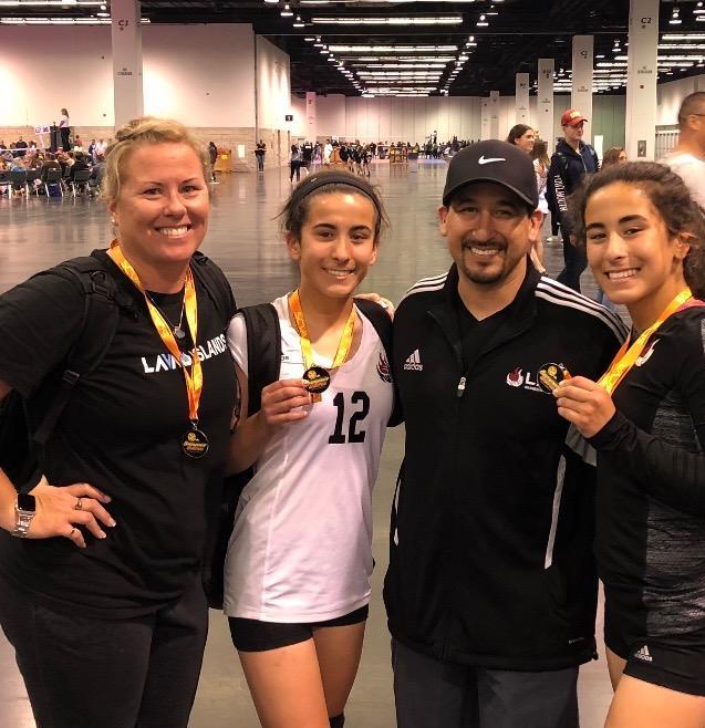 Mandy Rodriguez (far left) is joined by husband Leo and twin daughters Adrianna and Isabella