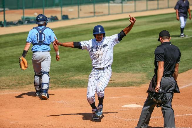 Mark Pena celebrates scoring the game-winning run against El Camino