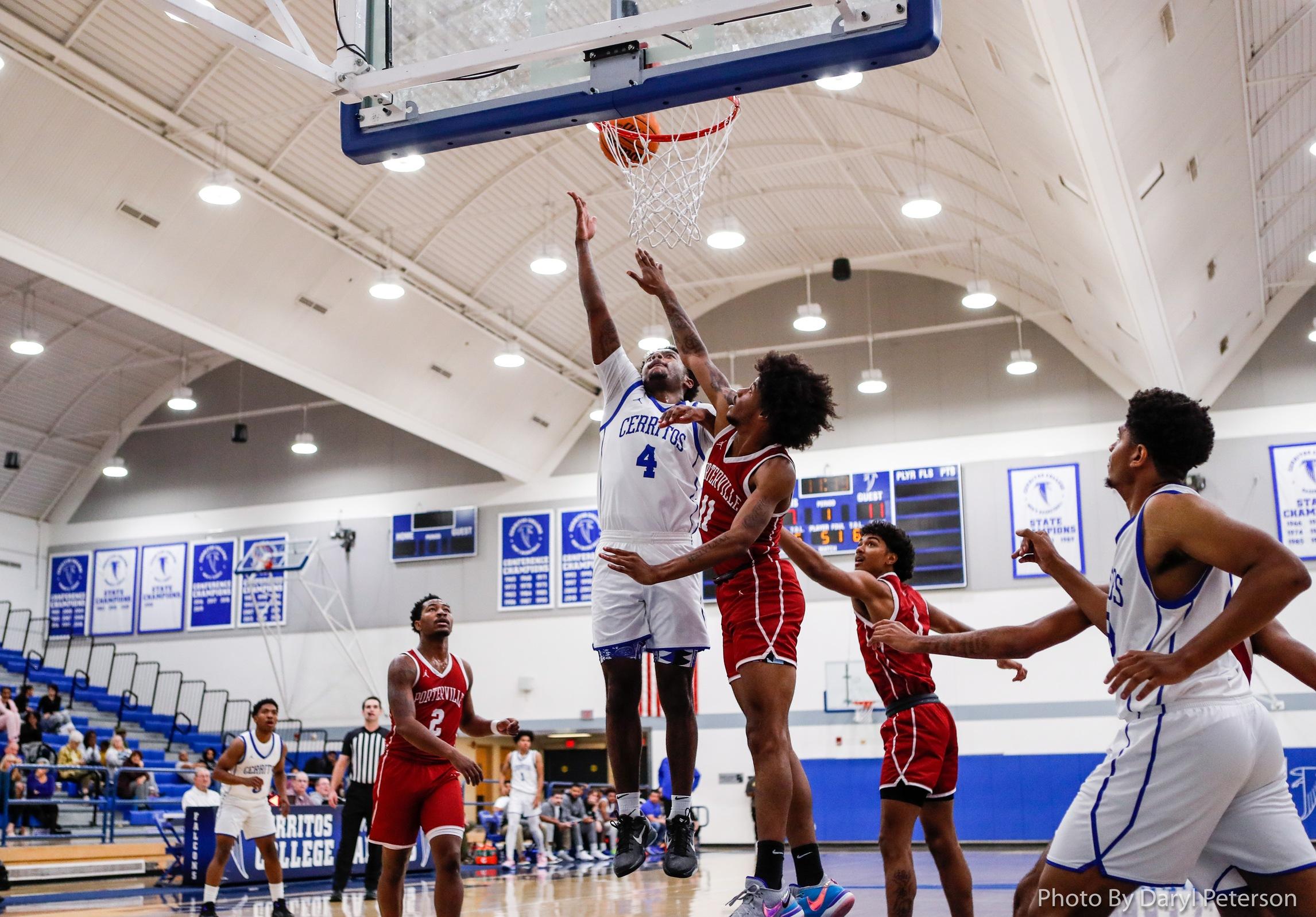 Miles Ceballos scores two of his 16 points for the Falcons