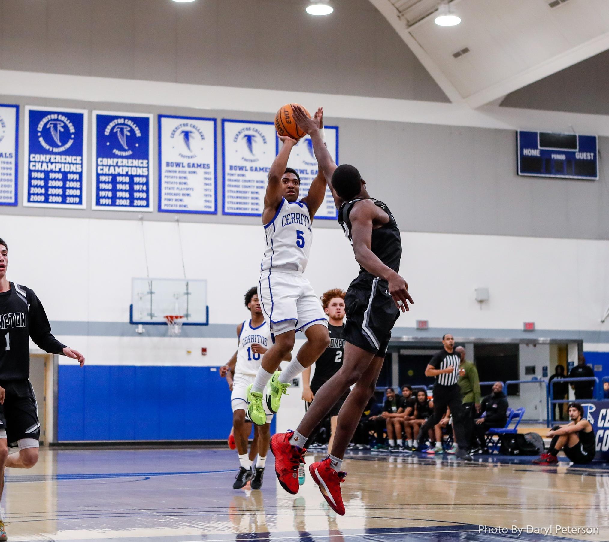 Darron Henry knocks down a three-pointer as the shot clock expires to help the Falcons beat Compton