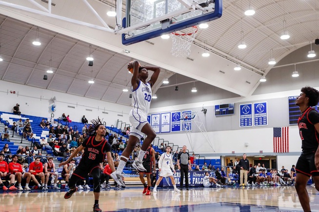 Spencer Ezewiro slams home two of his 16 points against Long Beach City