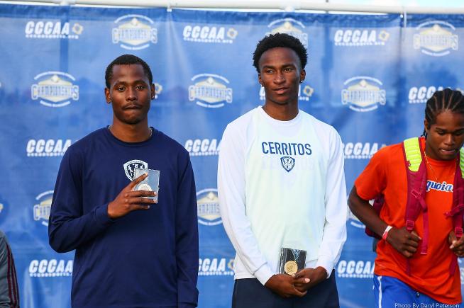 Vincent Calhoun and Stacy Chukwumezie receive their long jump medals