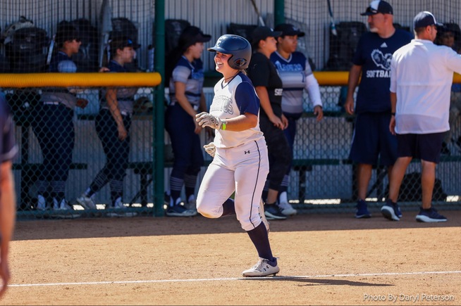 Brooklyn Bedolla comes home after her three-run home run in the Falcons playoff win