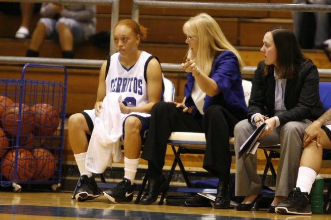 Trisha Raniewicz (far right) has been hired as the new women's basketball head coach