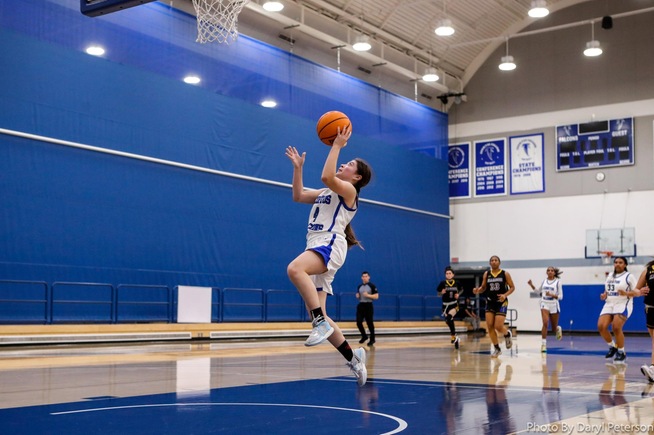 Damarie Saldivar goes in for two of her career-high 28 points against LA Harbor