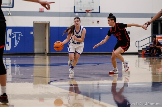 Damarie Saldivar drives for two of her game-high 23 points