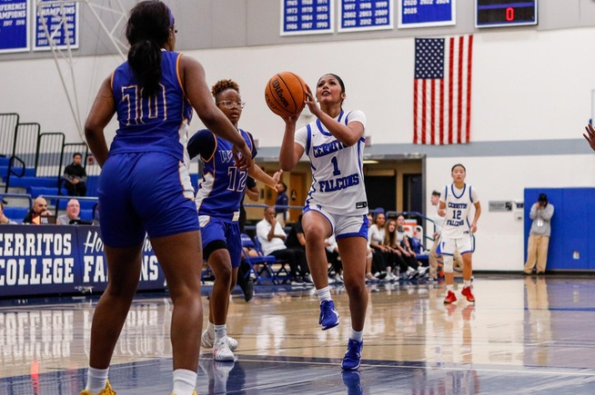 Justine Lucero (1) goes in for two of her team-high 17 points for the Falcons