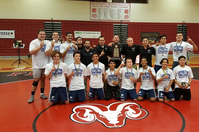 Donny Garriott (back row with trophy) celebrates with his 2016 team dual state championship team