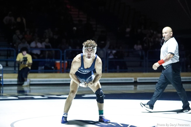 Isaac Gonzalez celebrates after his sudden victory over defending state champion Jason Saenz at 141 pounds.