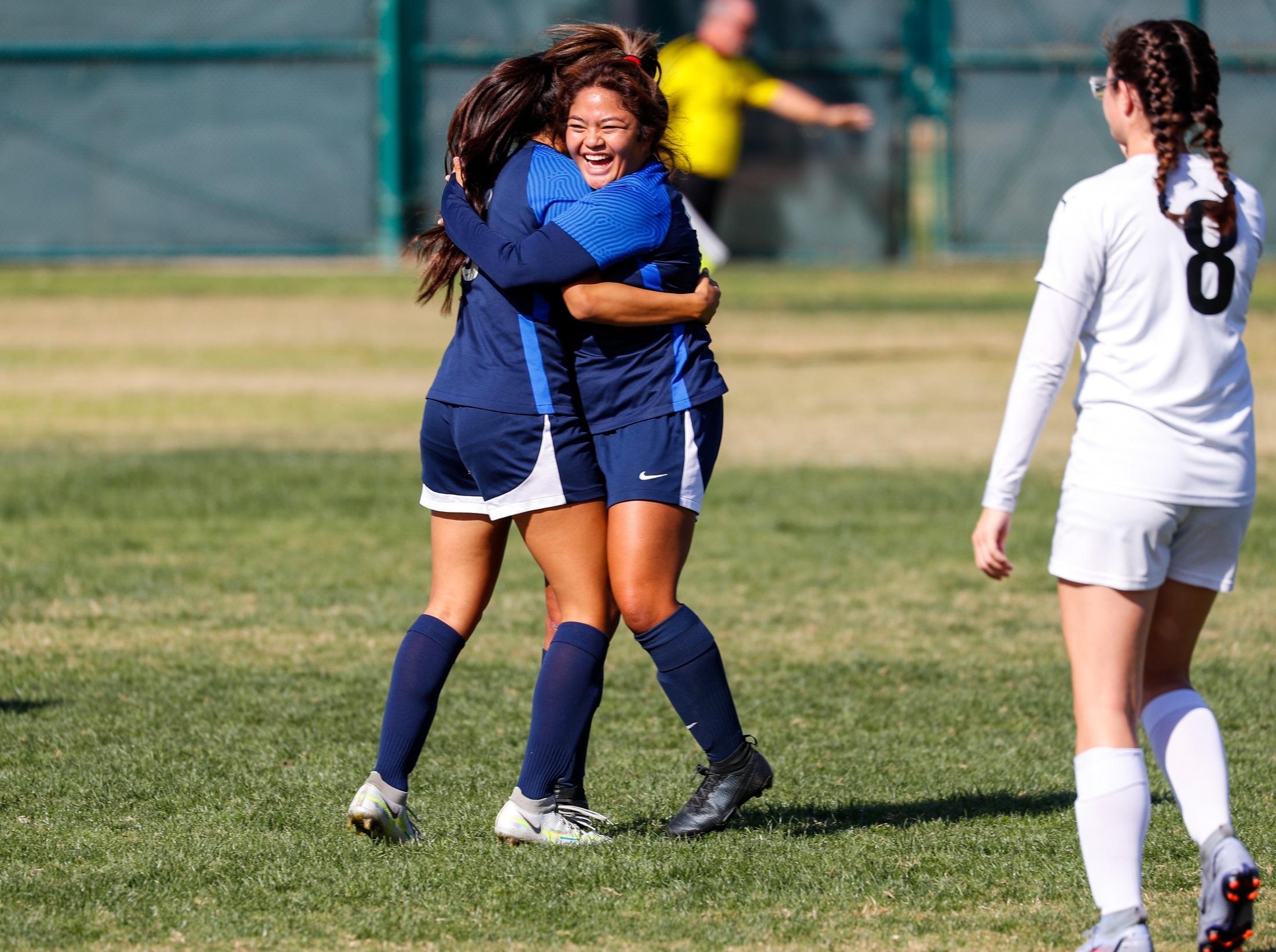 Meghan Legayada celebrates after scoring for the Falcons