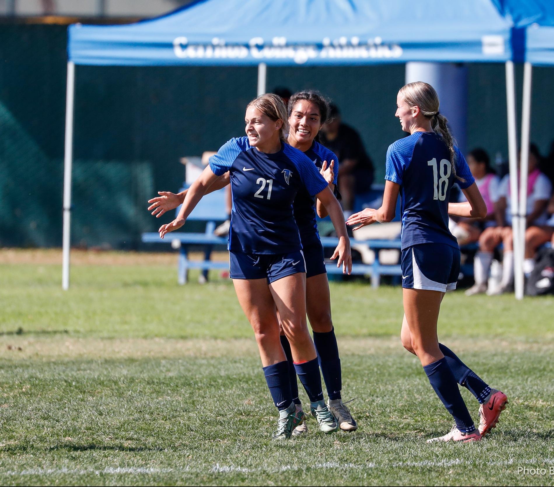 Sariah Sanchez (21) celebrates after scoring for the Falcons