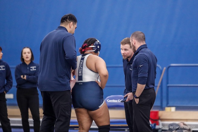 File Photo: Coaching staff talks with Raven Ross before a match